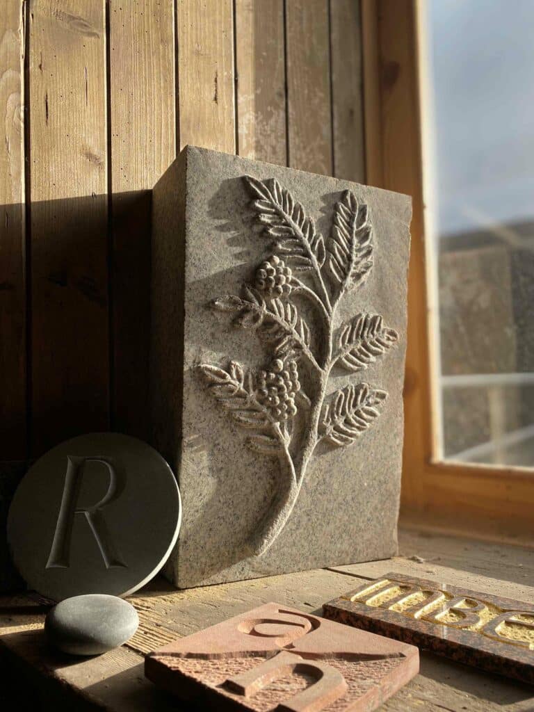 Rowan branch, Relief carving in granite